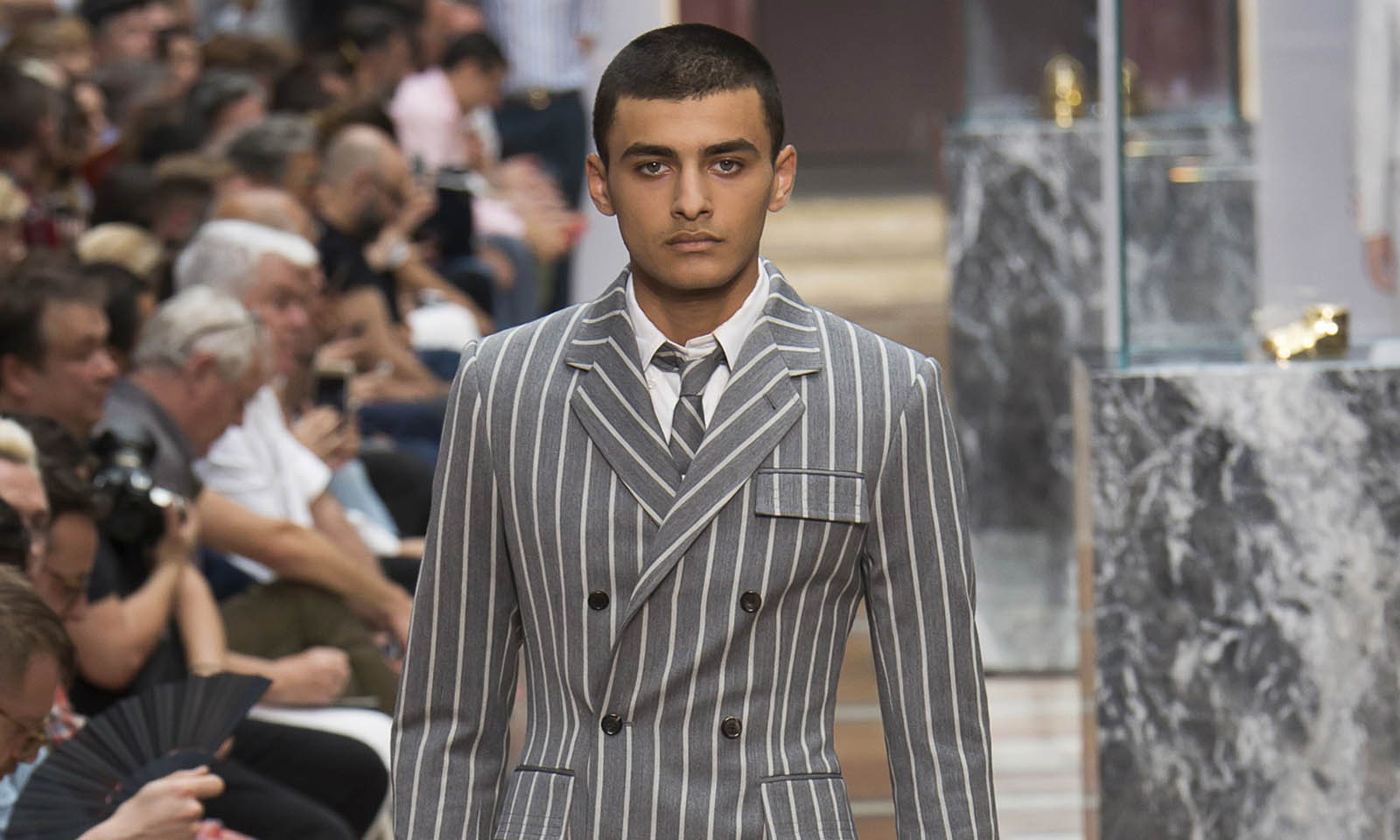 Male model walking the catwalk at Thom Browne SS18 men's fashion